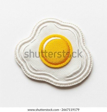 fried egg patch on a gray background