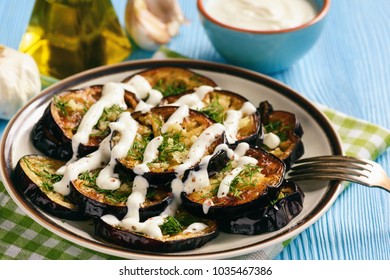 Fried eggplants with garlic and yogurt sauce. - Powered by Shutterstock