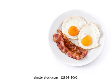 Fried Eggs And Bacon For Breakfast Isolated On White Background. Top View. Copyspace