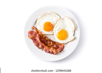 Fried Eggs And Bacon For Breakfast Isolated On White Background. Top View