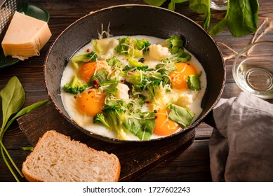 Fried Eggs With  Broccoli, Cheese, Spinach In A Pan On A Dark Wooden Background, Protein Healthy Breakfast