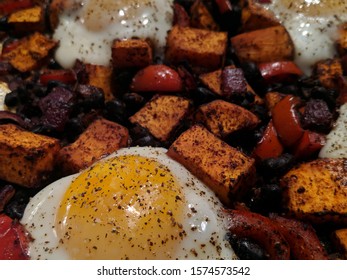 Fried Eggs On Top Of Sweet Potato Breakfast Hash