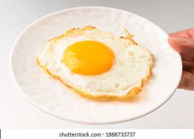 Fried Eggs On White Background