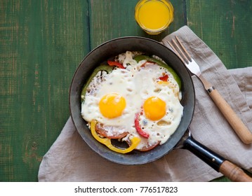 fried eggs with vegetables for breakfast