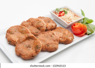 Fried Fish Cake, Served On White Dish