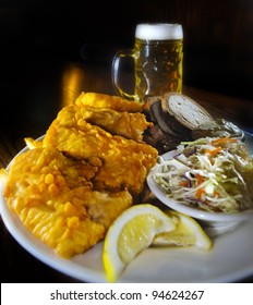 Fried Fish With Coleslaw Bread And Tartar Sauce, Glass Of Beer In The Back