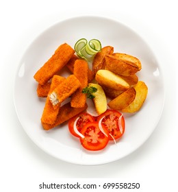 Fried Fish Fingers, Potatoes And Vegetables 