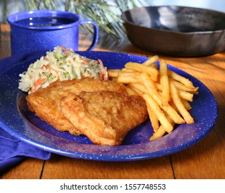 Fried Fish With Fries And Coleslaw On Blue Plate (horizontal).