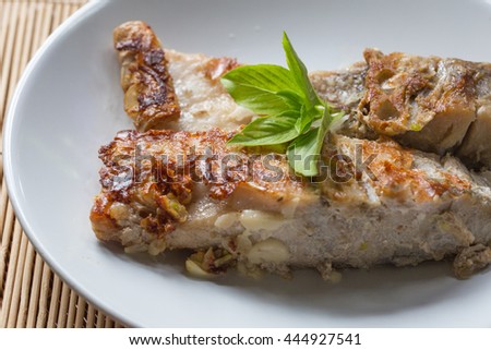 A fried fish and herb.