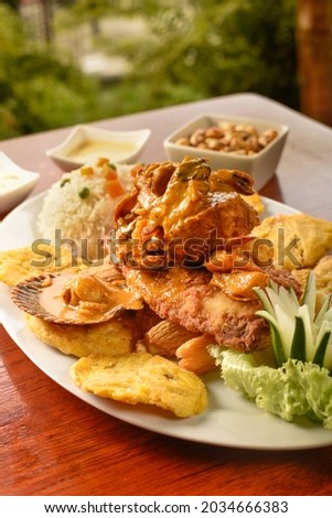Fried fish a lo macho, Peruvian dish with seafood sauce.