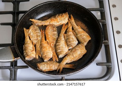 Fried Fish In A Pan On The Stove, Top View