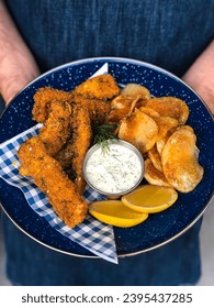 Fried fish pieces in the plate with curd  - Shutterstock ID 2395437285