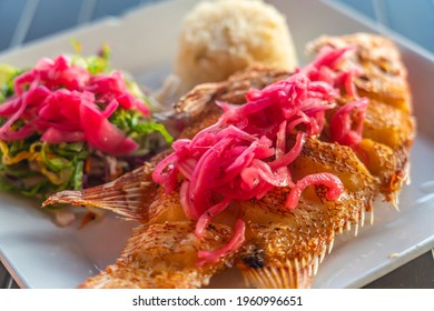 Fried Fish Platter In Mexico, With Rice, Vegetables And Red Onion, Selected Focus