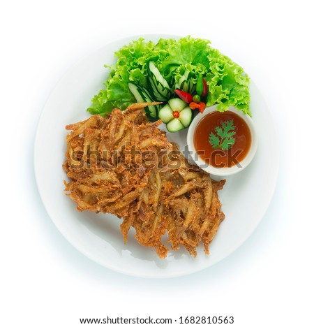 Fried Freshwater Small Fish Crispy Fried Thai Food Appetizer Easy dish Style Served Sweet Chili Sauce ontop Leaf Coriander Decorate carved Cucumber and vegetable topview