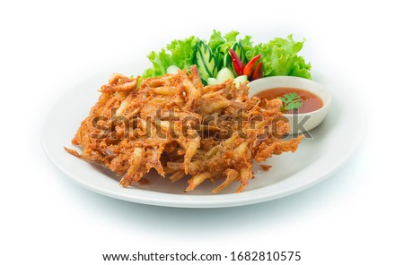 Fried Freshwater Small Fish Crispy Fried Thai Food Appetizer Easy dish Style Served Sweet Chili Sauce ontop Leaf Coriander Decorate carved Cucumber and vegetable sideview