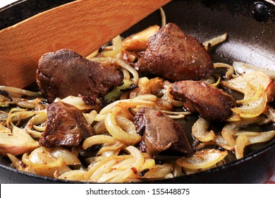 Fried Goose Liver With Onion In A Pan