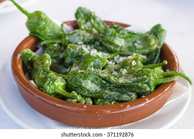 Fried green peppers Padron with olive oil and sea salt. Traditional Spanish tapas.