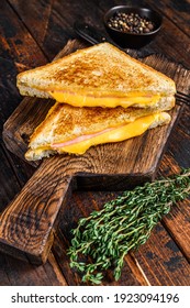 Fried Ham And Melted Cheese Sandwich. Dark Wooden Background. Top View