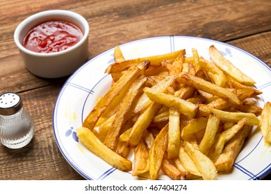 Fried Home Fries On Wooden Background