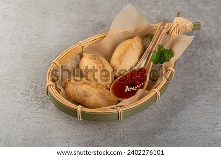 Fried hotcakes with dipping sauce. Dough patty filled with various fillings (meat, vegetable, cheese,rice). Popular snack in the Middle East and South Asia
