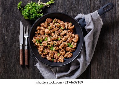 Fried Italian Sausage Of Freshly Ground Pork Meat And Spices In Skillet On Dark Wooden Table With Cutlery, Horizontal View  From Above, Flat Lay, Close-up