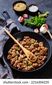 Fried Italian Sausage Of Freshly Ground Pork Meat And Spices In Skillet On Concrete Table With Ingedients On Background, Vertical View