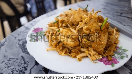 Fried kuey teow with egg ,chao kuey teow - stir fried rice noodles with soy sauce