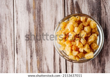 fried lard cracklings on a wooden rustic background.