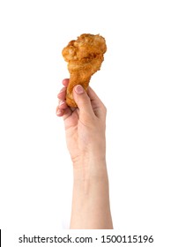 Fried leg in hand on a white background. Fried chicken leg close-up in hand.