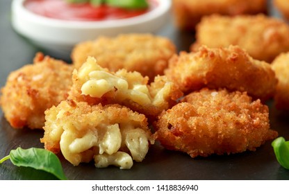 Fried Mac, Macaroni And Cheese Bites In Breadcrumbs With Ketchup Sauce