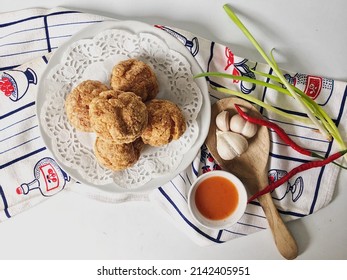 Fried Meatballs In White Plate With Chili Garlic Sauce