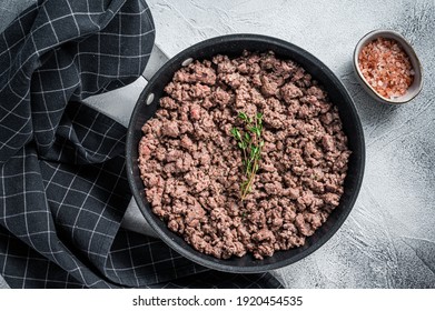 Fried Mince Beef And Lamb Meat In A Pan With Herbs. White Background. Top View