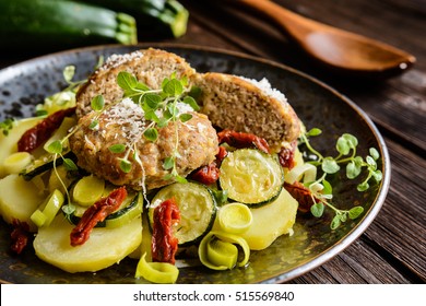 Fried Minced Pork Patties Meat With Steamed Potato, Zucchini, Leek And Sun Dried Tomato