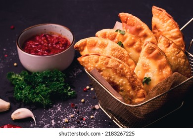 Fried mini pasties, with red sauce, top view, close-up, no people, selective focus,