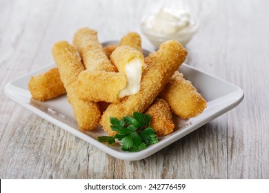 fried mozzarella cheese sticks breaded - Shutterstock ID 242776459
