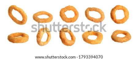 Fried onion rings falling on white background, banner design 