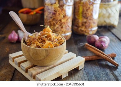 fried onions in the wooden bowl