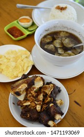 Fried Oxtail Served With Black Soup And Steamed Rice