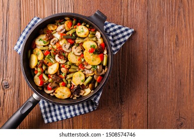Fried pan vegetables, with mushrooms and dried tomatoes. Seasoned with a mix of herbs.
