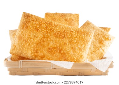 Fried Pastels, Brazilian Pastel Frito, on a basket, white background - Shutterstock ID 2278394019