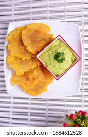 

Fried Patacones With Guacamole Sauce 