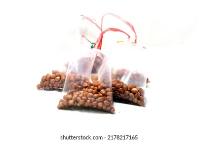 Fried peanut in plastic bag packaging for sell isolate on white background - Shutterstock ID 2178217165