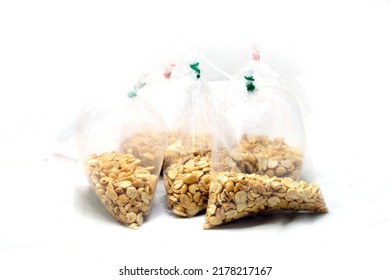 Fried peanut in plastic bag packaging for sell isolate on white background - Shutterstock ID 2178217167