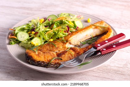 Fried Perch Fish With Salad On Plate