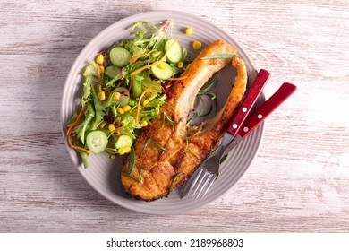 Fried Perch Fish With Salad On Plate