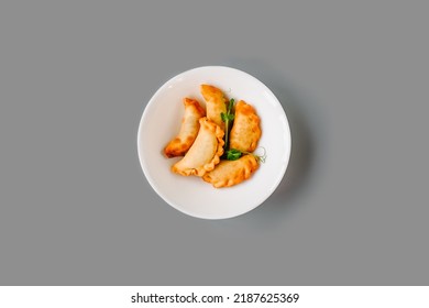 Fried Pies On A White Plate On Gray Background. Russian Tea Time. Top View.