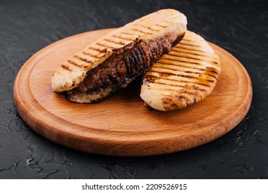 Fried Pita With Pork Steak On Wooden Tray