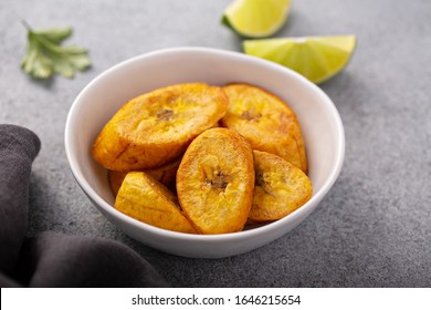 Fried Plantains With Fresh Lime In The Background, Carribean Cuisine