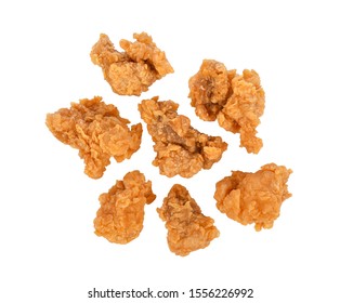 Fried popcorn chicken isolated on white background. Top view - Shutterstock ID 1556226992