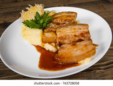 Fried Pork Chop, Mashed Potato And Vegetable Salad In Plate On A Wooden Background.